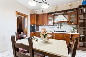 Dining - GuestHost - Comfortable 90sqm apartment able to accommodate up to 5 people. Located on the first floor, without lift, of a typical ancient Catania building, the apartment is spread over 2 levels and has a double facing with a small balcony. The building  (Catania)