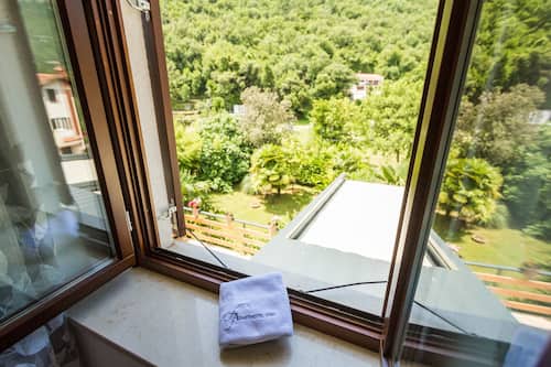 Deluxe appartement | Uitzicht vanuit de kamer