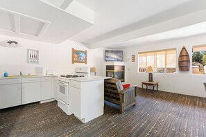 Grizzly Bear | Living area | 55-inch flat-screen TV with digital channels, streaming services - SoCal Vacations - Village Inn (Big Bear Lake)