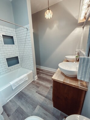 Combined shower/tub, hair dryer, towels, toilet paper