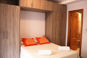 1 bedroom, desk, iron/ironing board, travel crib
