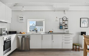 Fridge, stovetop, dishwasher, coffee/tea maker