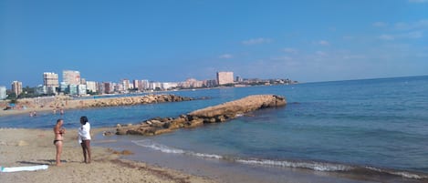 On the beach, sun loungers