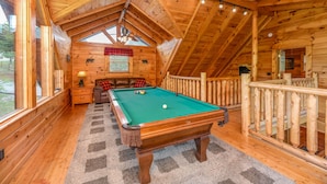 A cozy wooden cabin with a pool table, a fireplace, and a balcony. - FlatBackyard, FirePit, HotTub, Horseshoes, games, 60-game arcade FUN 4 FAMILIES! (Sevierville)