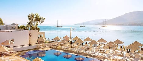 Seasonal outdoor pool, open 9:00 AM to 6:00 PM, pool umbrellas