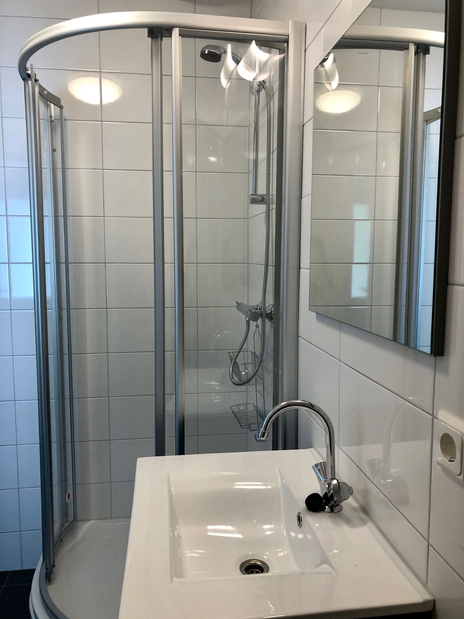 Shower, hair dryer, soap, toilet paper