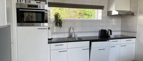 Coffee/tea maker, fridge, microwave, oven
