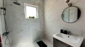 Combined shower/tub, hair dryer, towels, soap