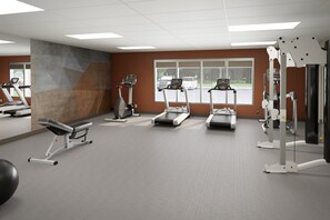 Work out in style with our fully equipped gym featuring treadmills, a bench press, and a cable machine.