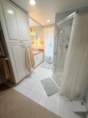 Shower, hair dryer, towels, soap