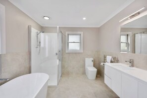 Bathtub, hair dryer, towels