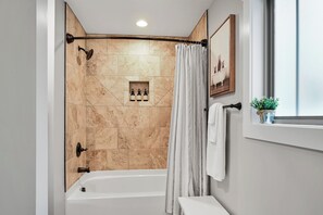 Combined shower/tub, hair dryer, towels, soap