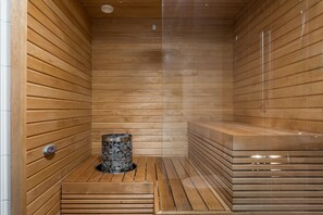 A sauna with wooden walls and benches.