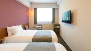 A hotel room with two beds, a small table, a TV, and a window with curtains. - M's Hotel Kyoto Station Taruya (Kyoto)