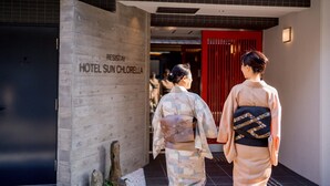A wooden entrance with a sign for 'Hotel Sun Chorella'. - RESI STAY HOTEL SUN CHLORELLA　 (Kyoto)