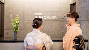 A reception area with a sign reading "HOTEL SUN CHORIYA". - RESI STAY HOTEL SUN CHLORELLA　 (Kyoto)
