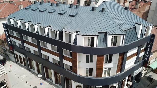 A modern hotel with a curved facade, multiple balconies, and a rooftop terrace. - Asiwa Otel (Eskisehir)