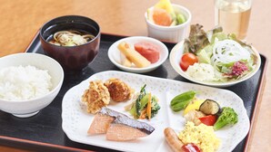 A tray with various dishes including rice, fish, vegetables, and a bowl of soup. - Hotel Paco Obihiro Chuo (Obihiro)