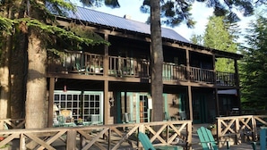 A two-story wooden building with balconies, large windows, and outdoor seating. - The Historic Northern Hotel (Coolin)