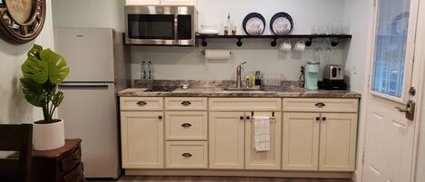 Fridge, microwave, stovetop, coffee/tea maker