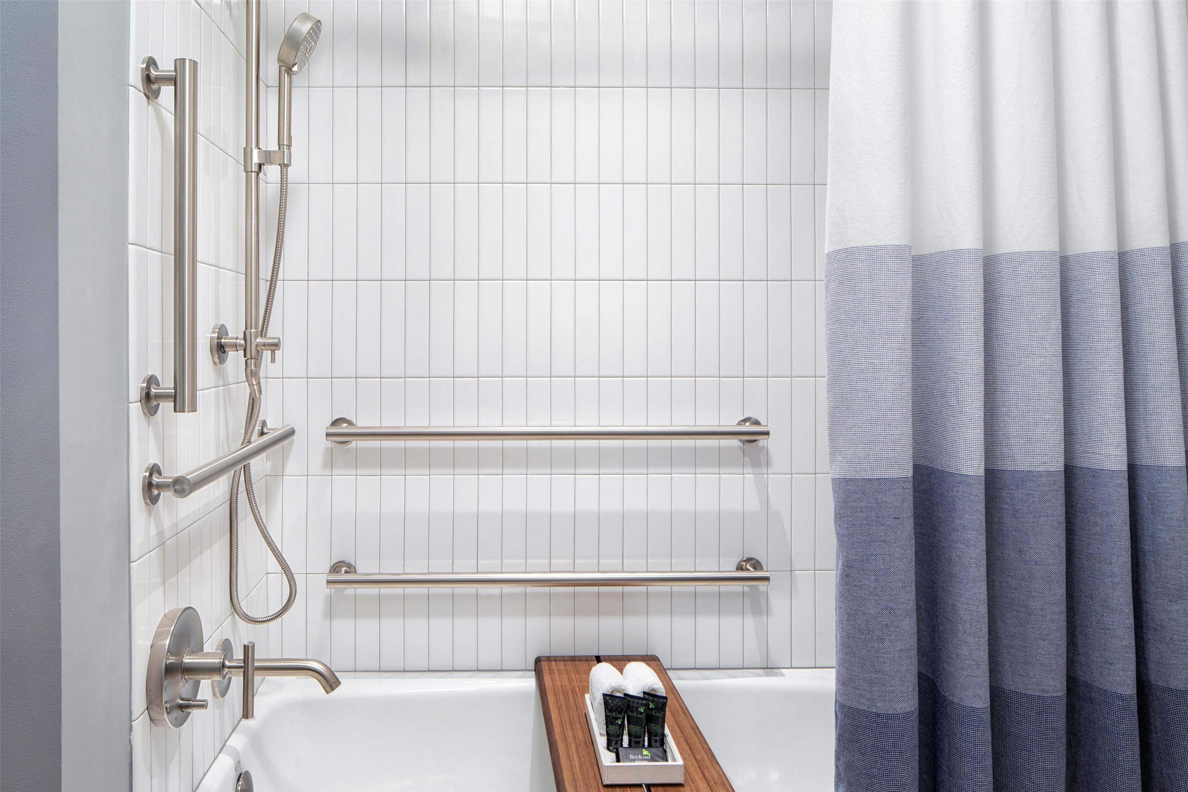 designer toiletries, hair dryer, bathrobes, slippers