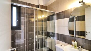 Shower, hair dryer, towels, soap
