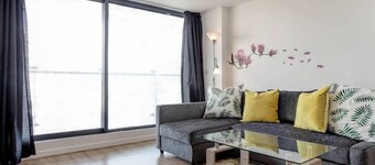 Clean and modern Riverside Flat w/ Private Balcony