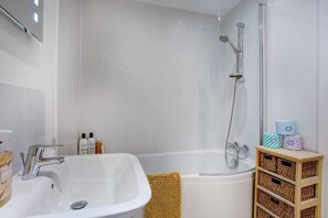 Bathtub, hair dryer, towels