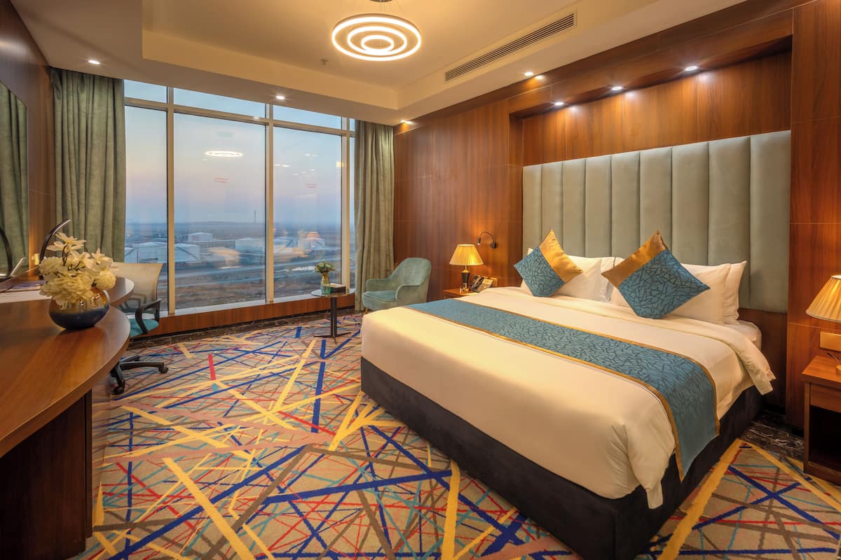 suite with city view airport | premium bedding, tempur-pedic beds, minibar, in-room safe
