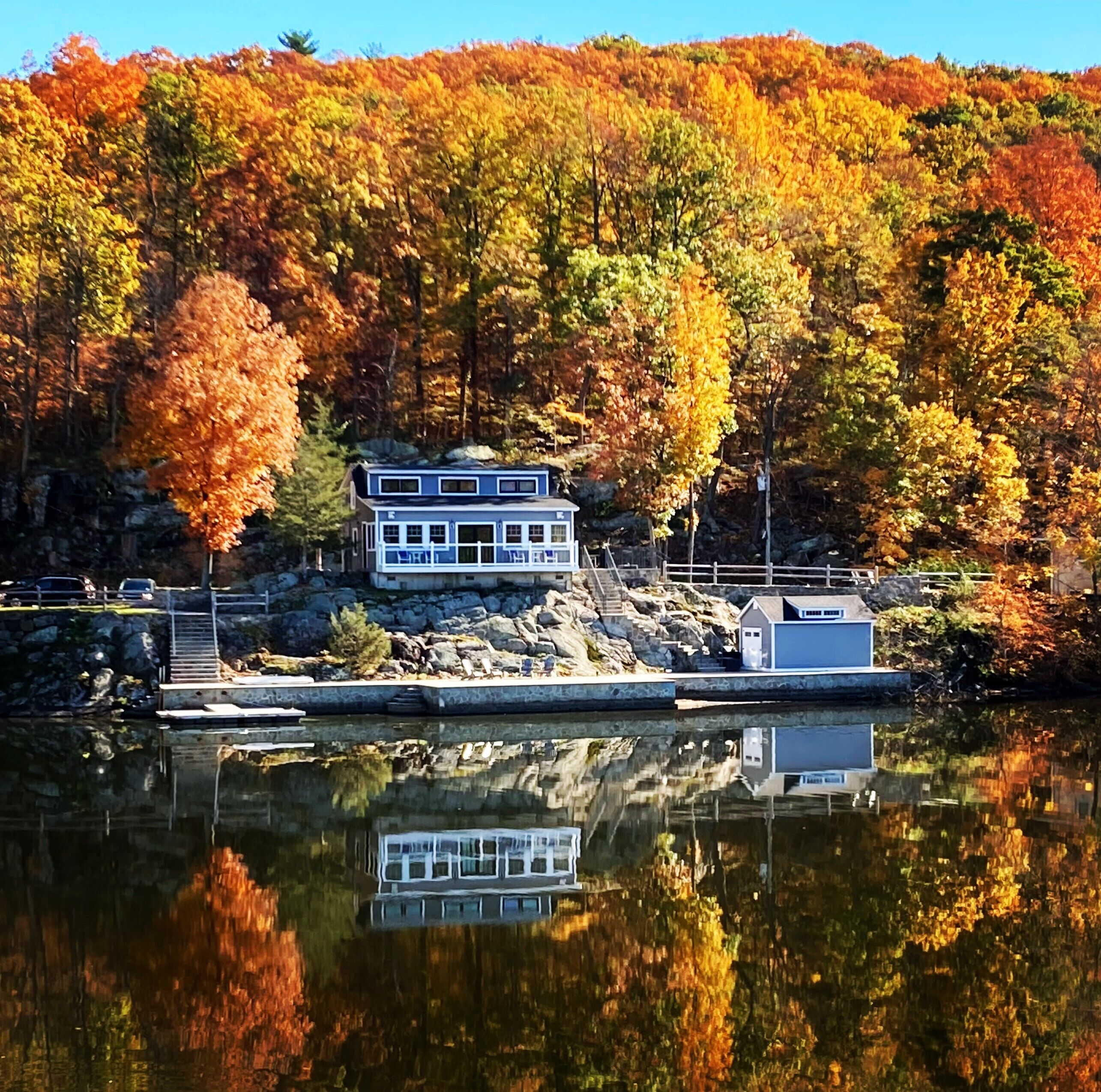 Stunning lakefront and beautiful sunsets with extensive multi-level patios