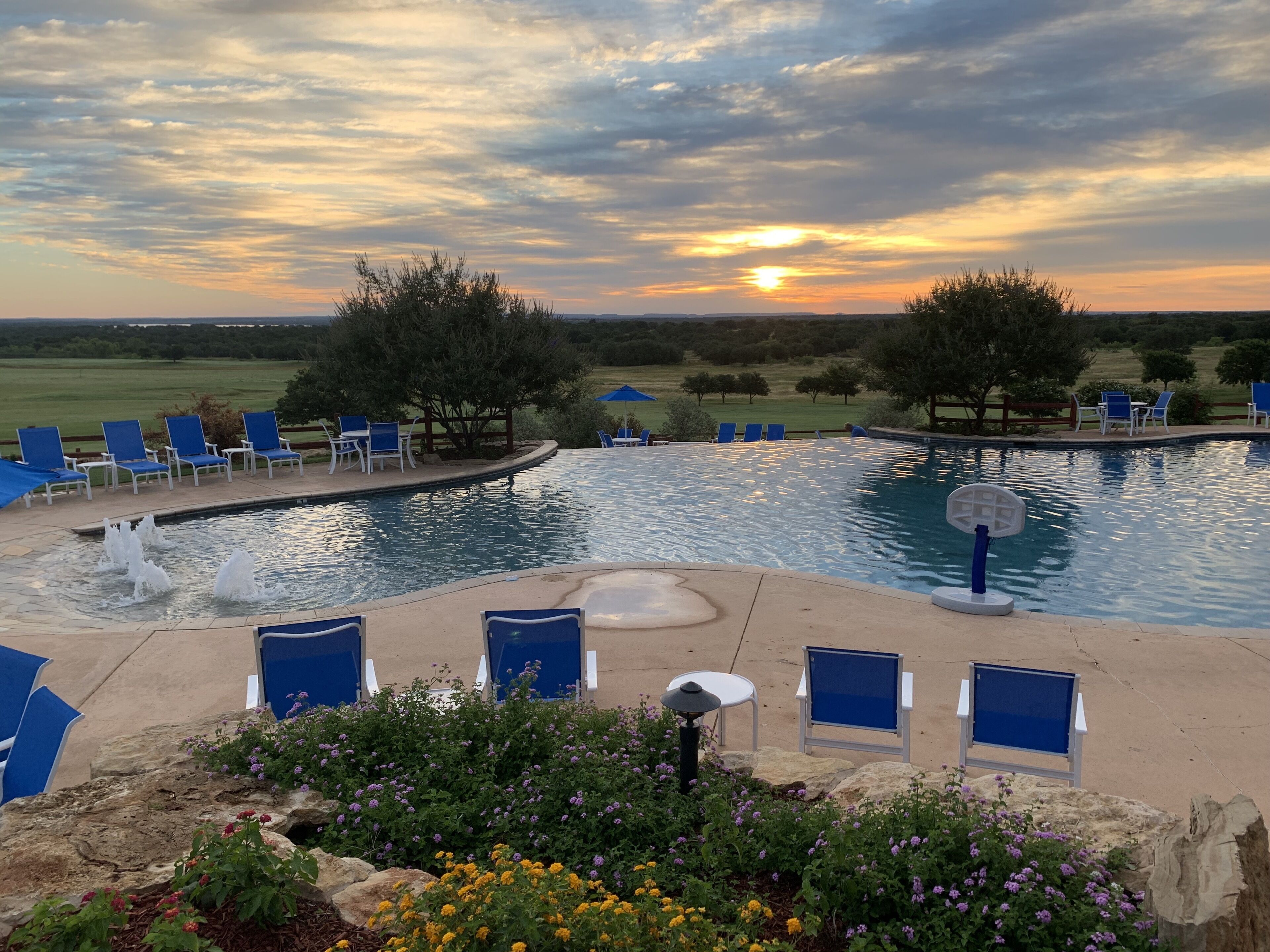 seasonal outdoor pool, open 10:00 am to 10:00 pm, pool umbrellas