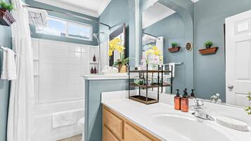Combined shower/tub, hair dryer, towels, soap