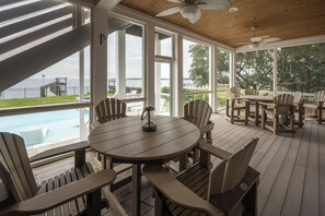 Outdoor dining - Sunset Bay 5 Bedroom Home with a Jacuzzi Tub, Work-Out Room and Bayside Access! (Kill Devil Hills)