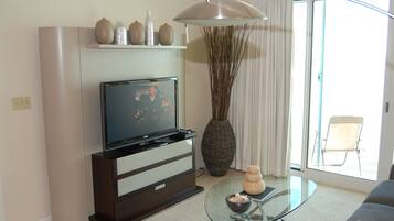 Condo, Multiple Beds, Private Pool, Beach View | Living room | 42-inch TV with cable channels
