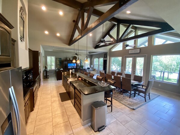 Enjoy meal preparation in this well-appointed kitchen with a large island, sink, and ample counter space.