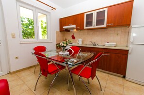 Apartment (Two Bedroom Apartment with Terrace) | Private kitchen | Fridge, electric kettle - Apartments Ivana (Trogir)