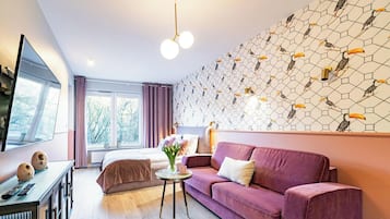 Deluxe Apartment, Multiple Beds, Pool Access, Park View (NTC305) | Living area | 42-inch flat-screen TV with cable channels, TV, toys