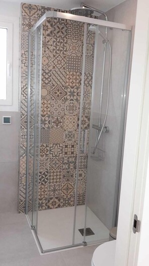 Bathtub, hair dryer, towels, soap