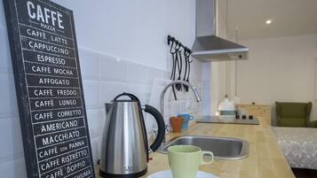 Fridge, oven, highchair, cookware/dishes/utensils