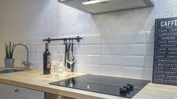 Fridge, oven, highchair, cookware/dishes/utensils