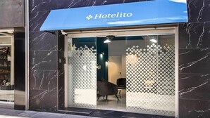 A hotel entrance with a blue awning labeled "Hotelito Boutique." - Hotelito Boutique Badalona Mar 4 (Badalona, Barcelona)