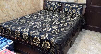 One bedroom apartment with attached kitchen and washroom along with fridge