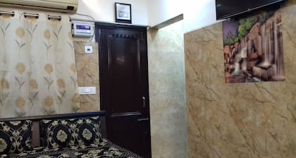One bedroom apartment with attached kitchen and washroom along with fridge