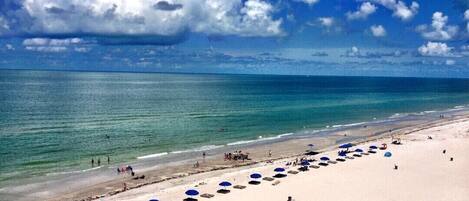 On the beach, sun-loungers, beach towels