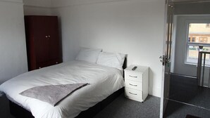 Standard Double Room, 1 Queen Bed (Shared) | Iron/ironing board, rollaway beds (surcharge), bed sheets - Sial Group Townhouse (Ilford)