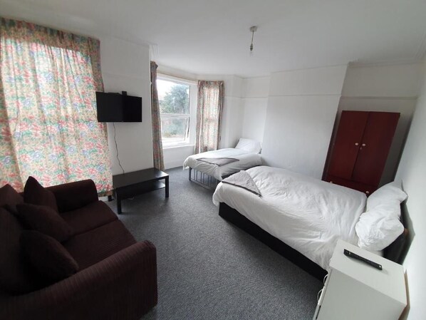 Standard Quadruple Room, Multiple Beds (Shared) | Iron/ironing board, rollaway beds, bed sheets