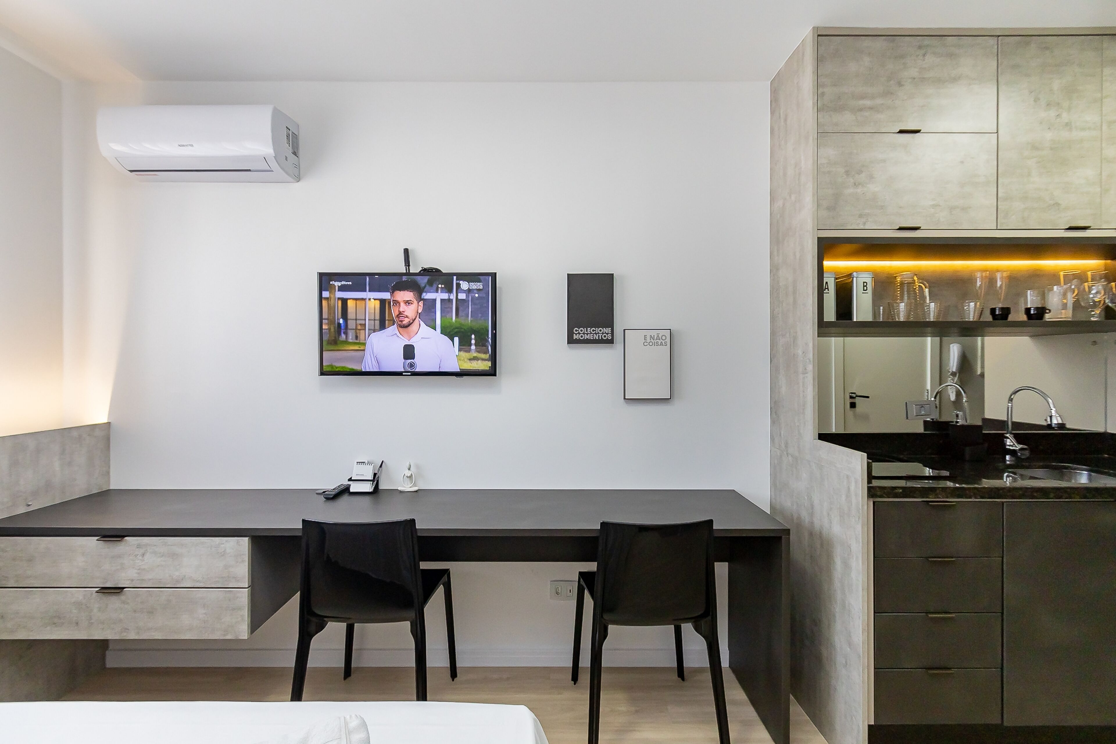A modern kitchen with a built-in oven, a sink, and a countertop.