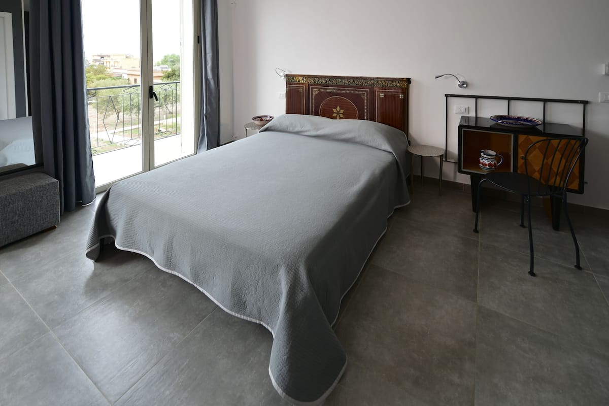 Deluxe Quadruple Room, Balcony, Pool View | Premium bedding, pillowtop beds, minibar, individually decorated
