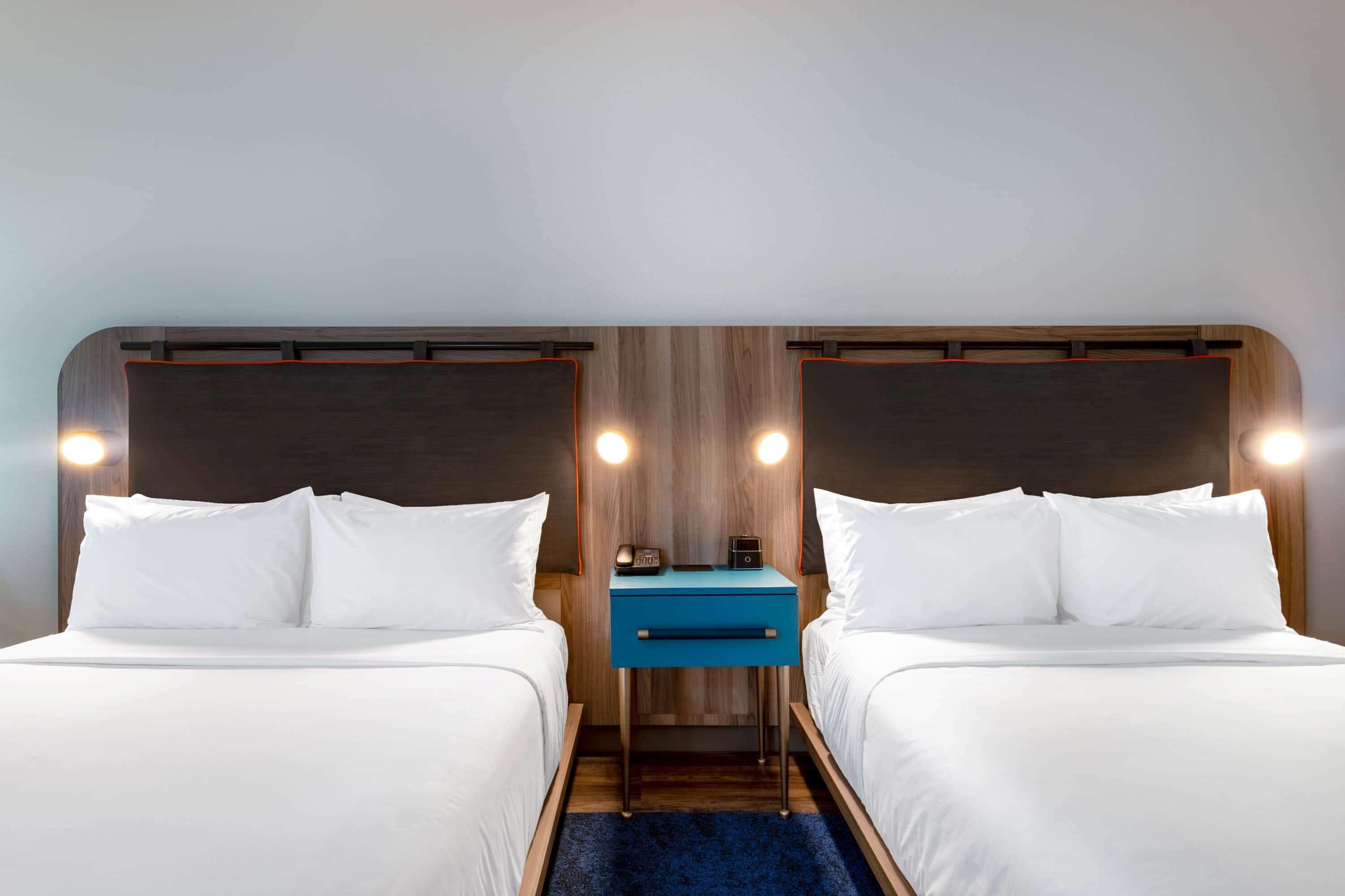 premium bedding, pillow-top beds, desk, laptop workspace