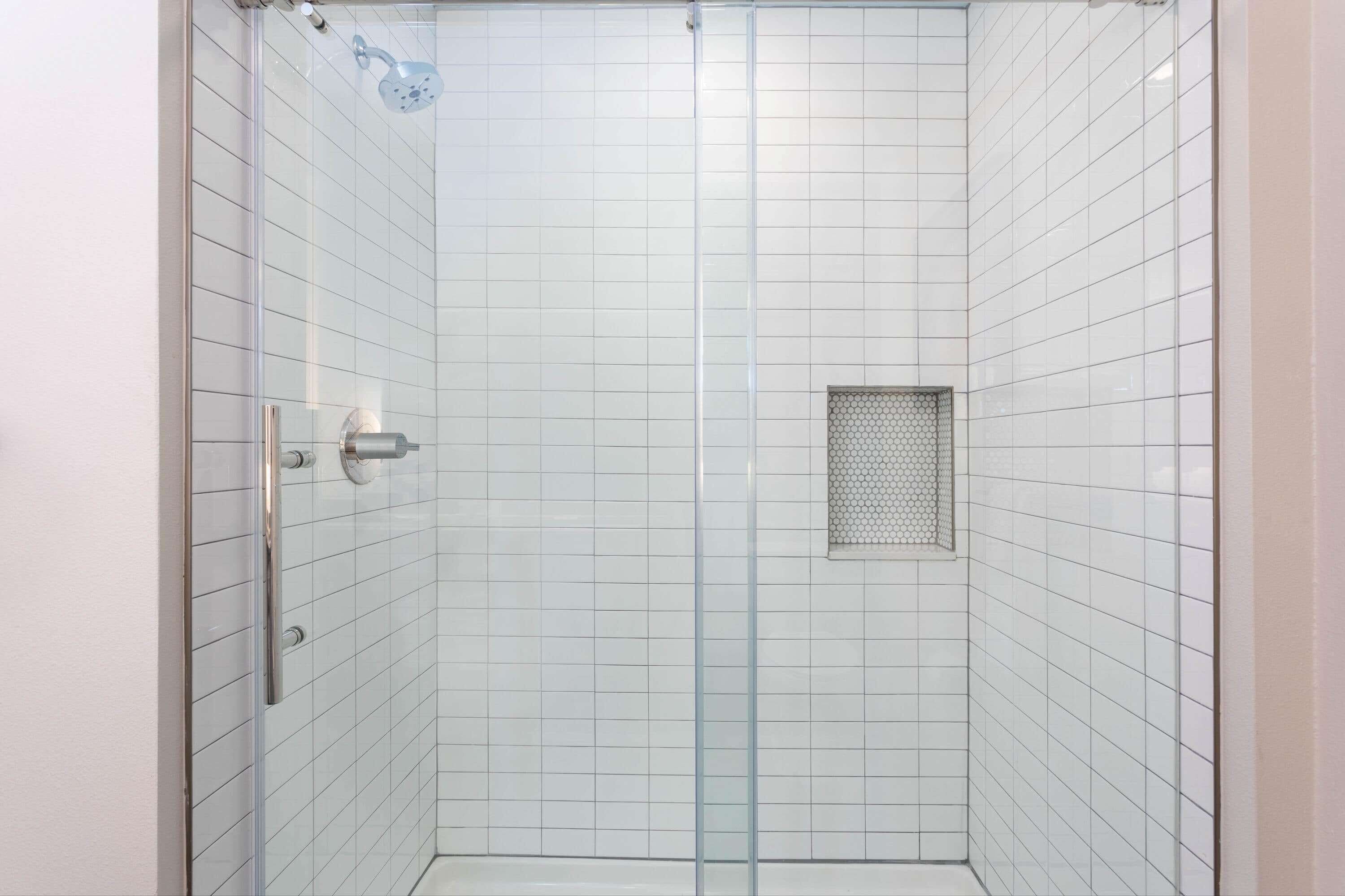 shower, designer toiletries, hair dryer, towels